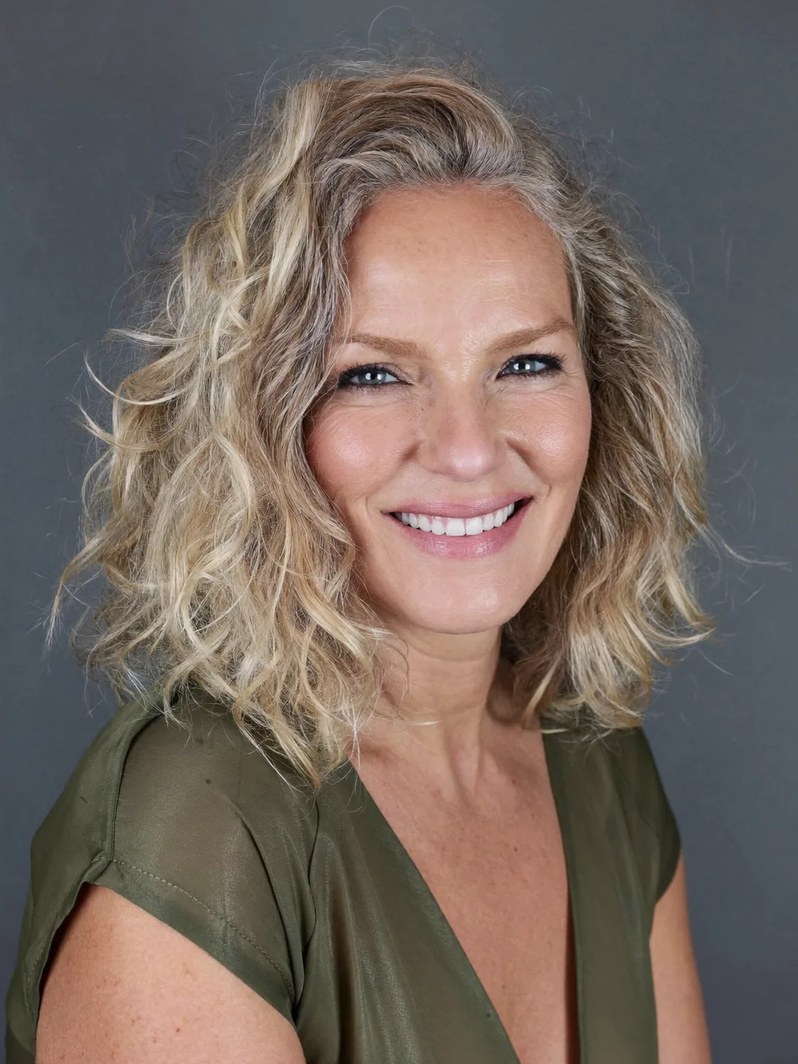 Voluminous Shoulder-Length Golden Sandy Blonde Bob